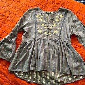 blue-gray top with Oversized cuffs